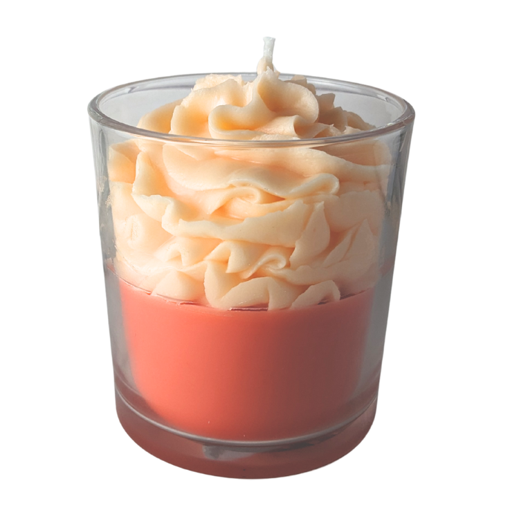 Candle in a glass holder with wavy texture on a white background