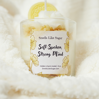 Candle with a label on a fluffy white surface